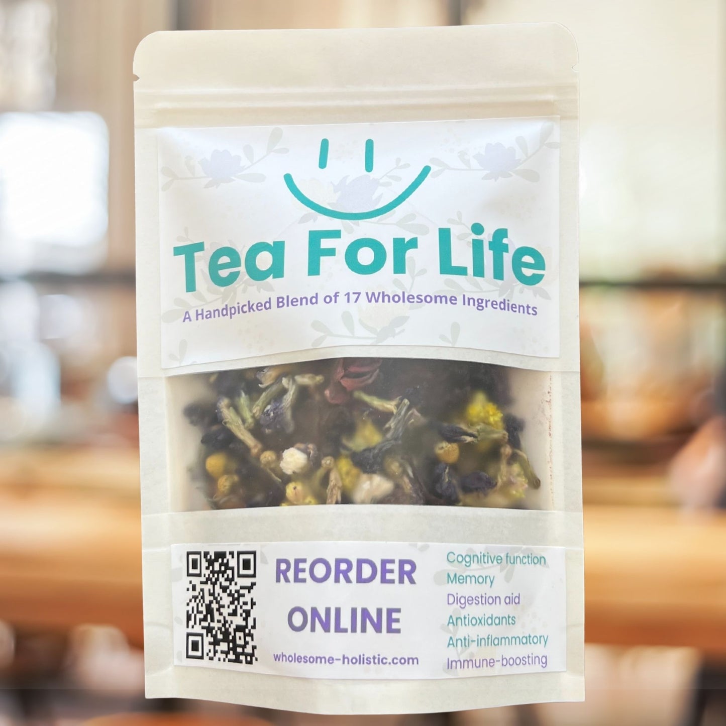 Tea For Life loose-leaf herbal tea in a resealable pouch with a clear window showing colorful dried ingredients; labeled as a 17-ingredient blend with benefits for memory, digestion, and immunity.